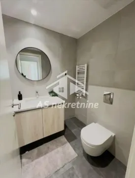 Modernly equipped bathroom with a washbasin and a wall-mounted toilet. - image 12