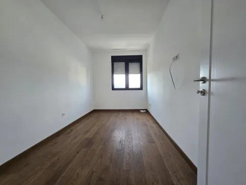 Empty room with white walls, wooden flooring and a window. - image 15
