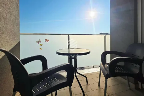 Furnished balcony with a table and two chairs. - image 14