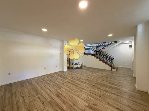 Spacious empty living room with a staircase and wooden flooring. - image 10