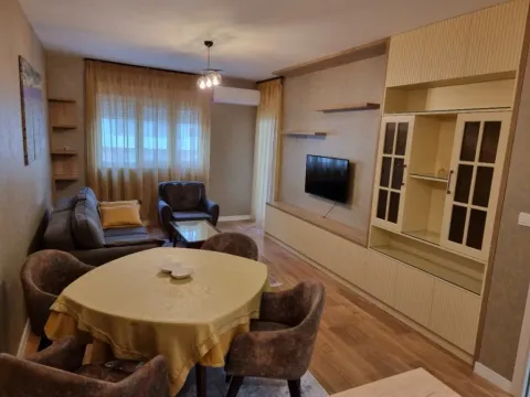 Living room with a dining table and sofa set. - image 5