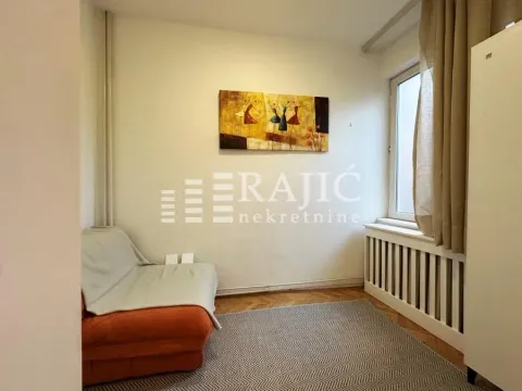 Small room with a bed, a window, and a decorative painting on the wall. - image 6