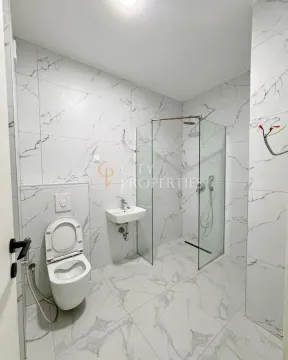 Newly equipped bathroom with a walk-in shower and marble-effect tiles. - image 7