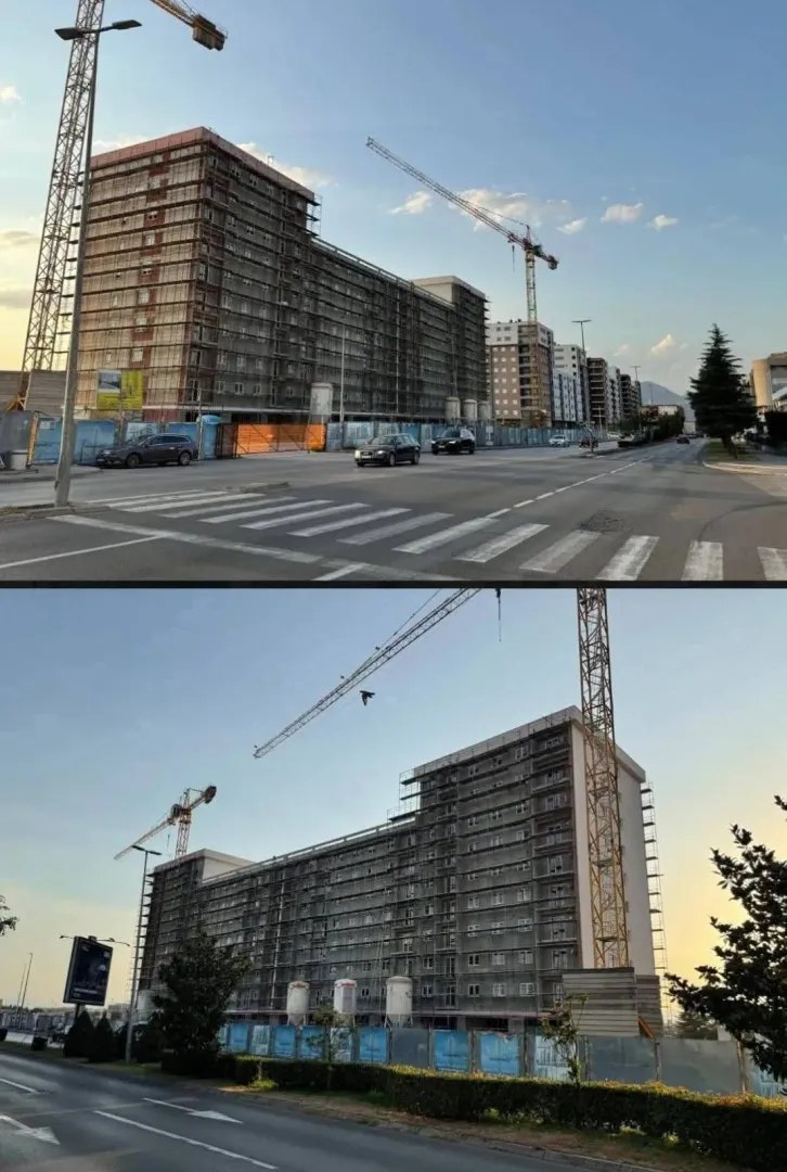 Spoljašnji izgled stambene zgrade u izgradnji sa kranovima.