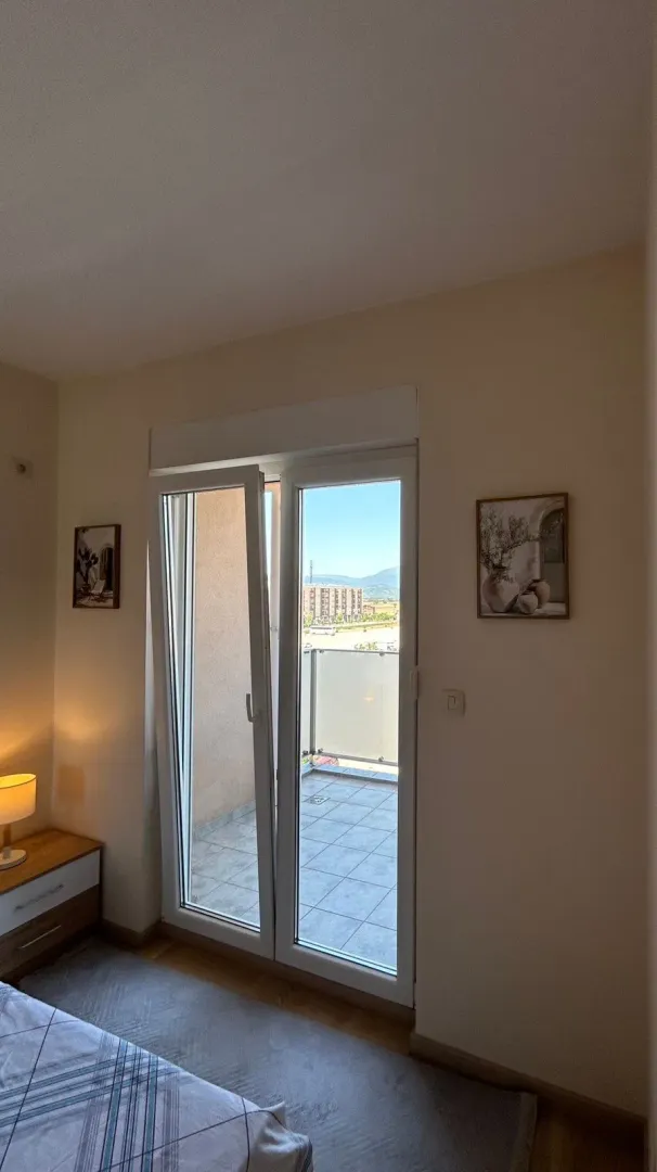 View from the bedroom towards the terrace with balcony doors.