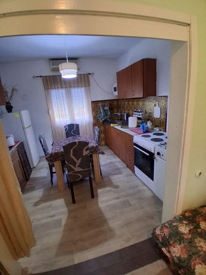 Dining area with kitchen and dining table.