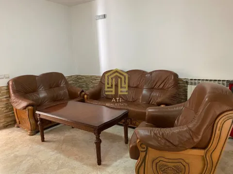 Living room with leather furniture sets and a wooden coffee table. - image 3