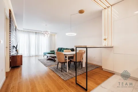 Living room with a dining area and modern furniture. - image 6