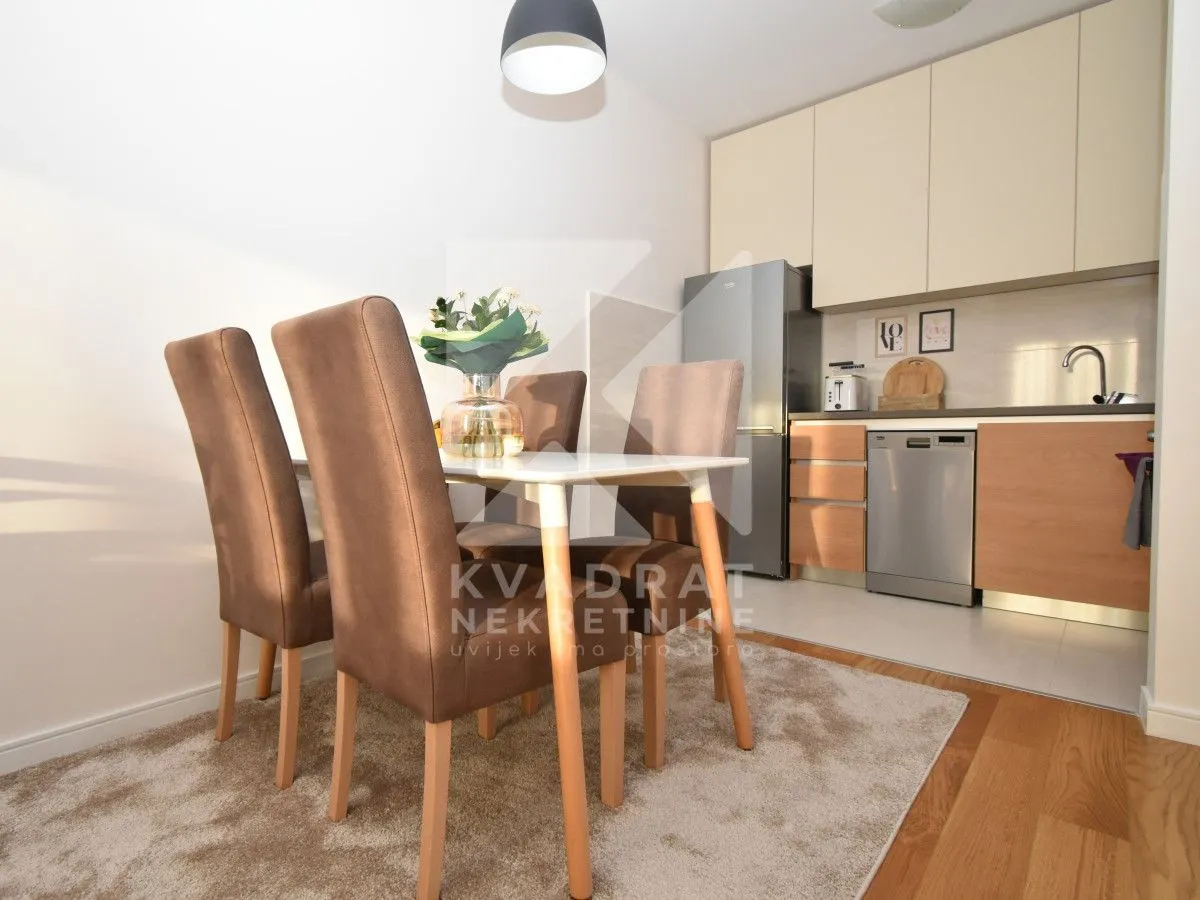 Kitchen with dining area and modern furniture.