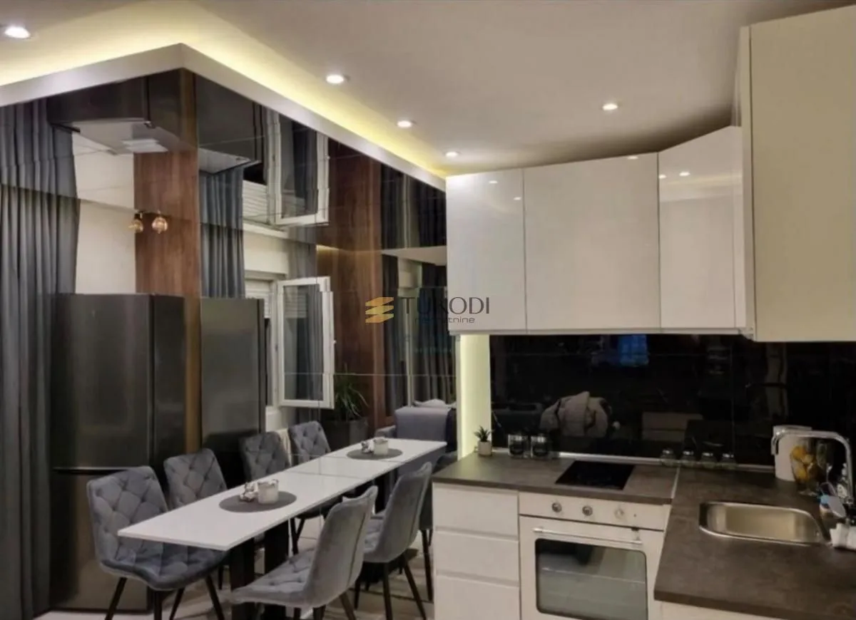 Modern kitchen connected to the dining area.