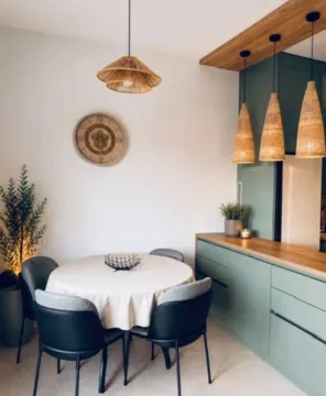 Modern kitchen with a dining table and chairs. - image 3