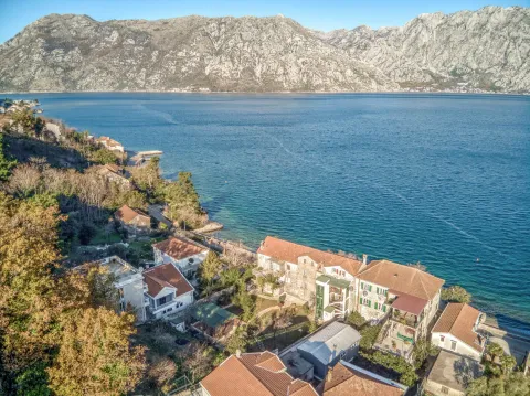 Bird's-eye view of the coastline with houses and the sea. - image 6