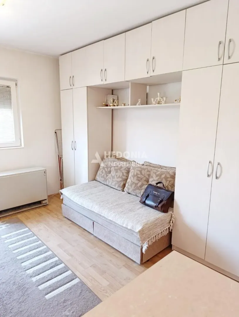 Bedroom with a bed and built-in wardrobes.
