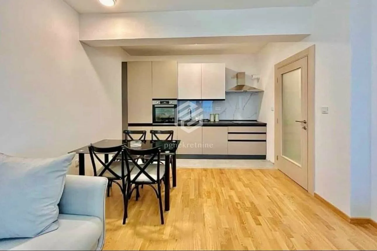 Kitchen with dining area and part of the living room.