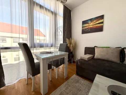 Living room with dining table and sofa set. - image 3