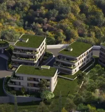 Aerial view of modern residential buildings surrounded by greenery. - image 9