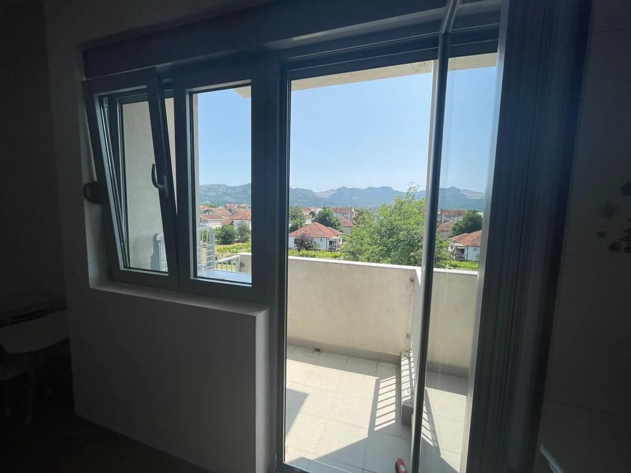 View from the terrace towards the surrounding neighborhood and hills.