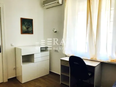 Bright bedroom with a desk and a chest of drawers. - image 9