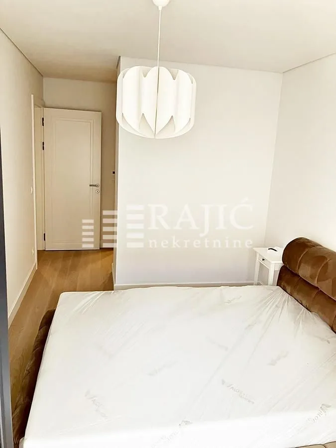 Furnished bedroom with a double bed.