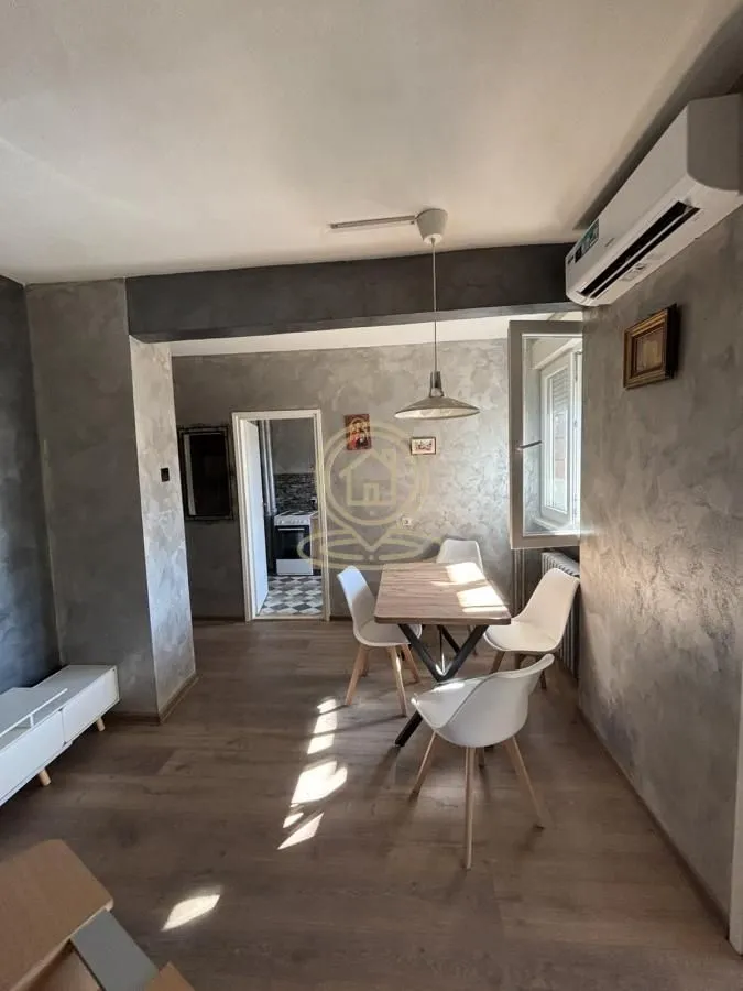 Living room with a dining table and chairs.