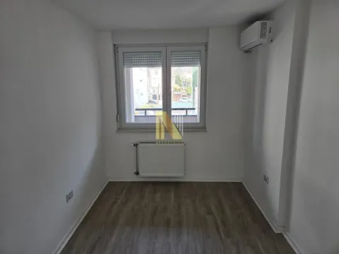 Empty bright room with a window and an air conditioner. - image 7