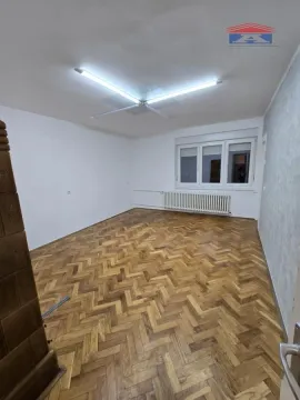 Empty room with parquet flooring and white walls. - image 3