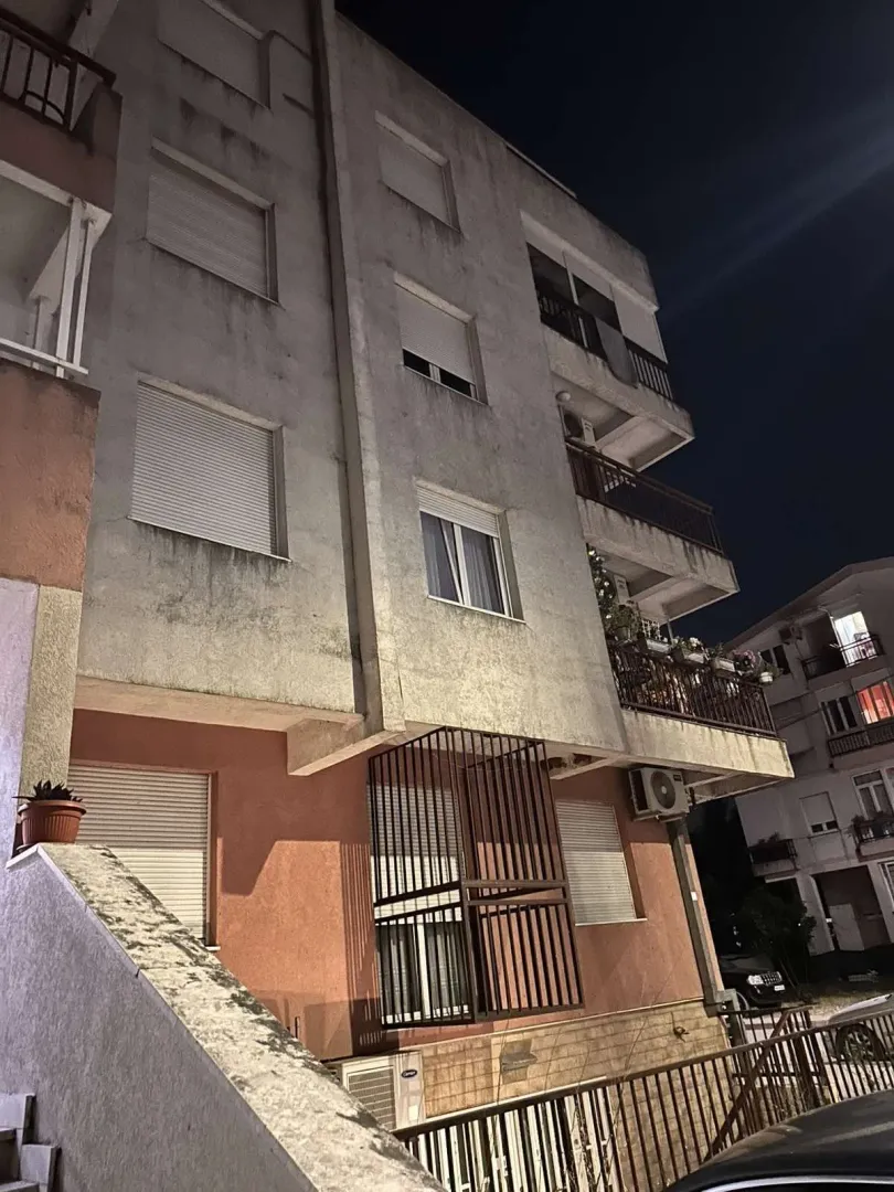 Exterior view of a residential building photographed at night.