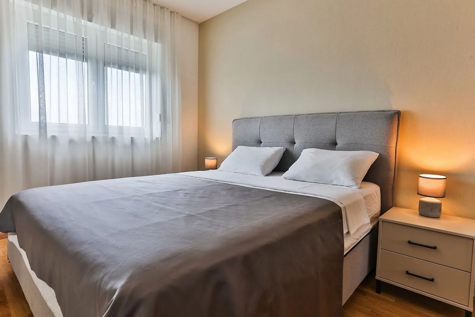 Furnished bedroom with a double bed and nightstands.
