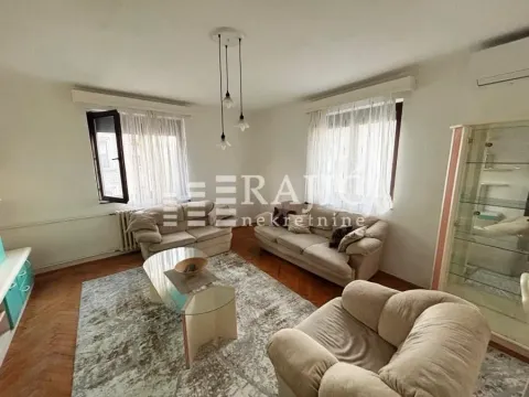 Spacious living room with seating furniture and parquet flooring. - image 3
