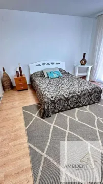 Bedroom with a double bed and a nightstand. - image 4