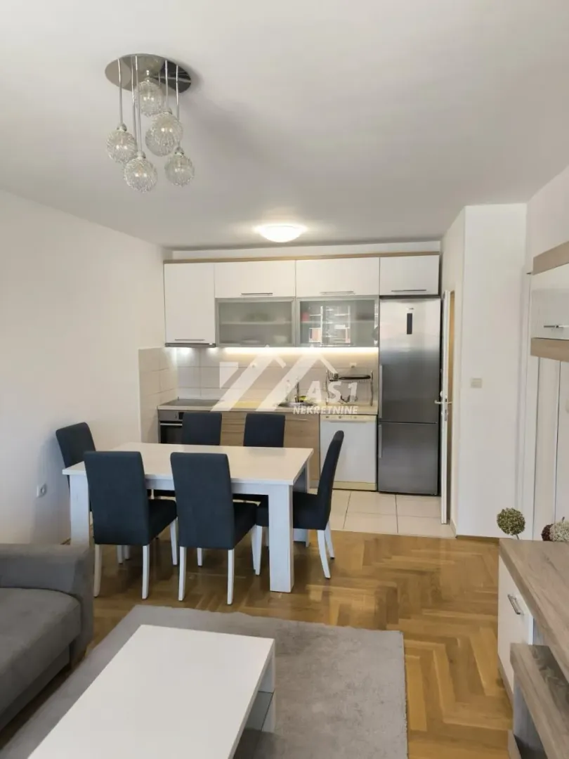 Kitchen with dining area and modern furniture.