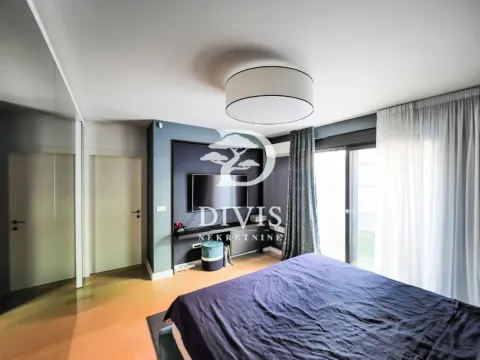 Furnished bedroom with a double bed, TV, and access to the terrace. - image 9