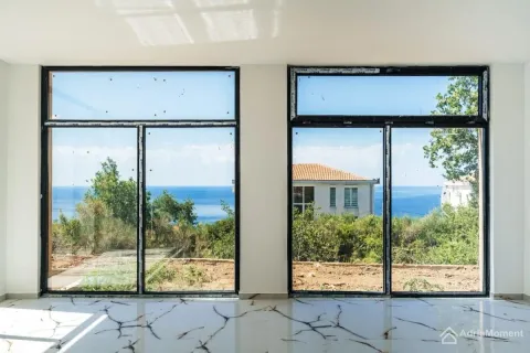 View of the sea through large windows from a bright empty room. - image 10