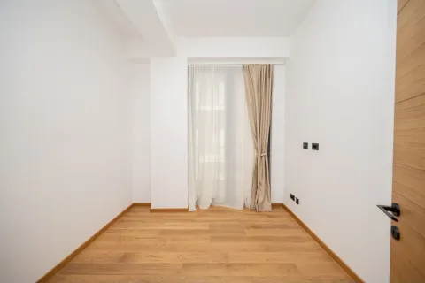 Empty bright room with parquet flooring and a window covered with curtains. - image 6