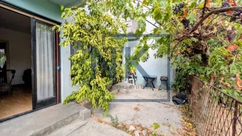 View of the courtyard and terrace with greenery in front of the property entrance. - image 16