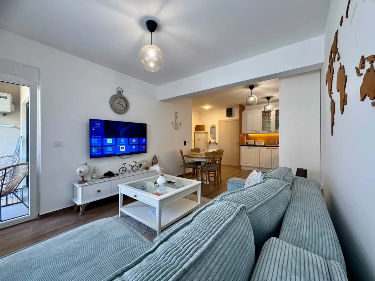 Spacious living room connected to the dining area and kitchen.