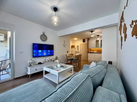 Spacious living room connected to the dining area and kitchen. - image 19