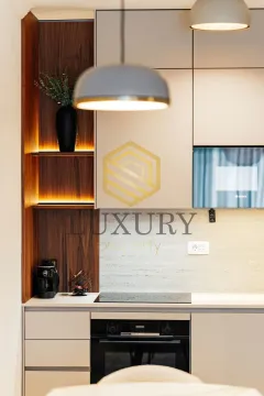 Modern kitchen with built-in units and lighting. - image 4