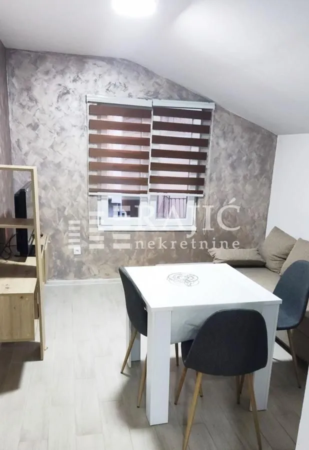 Living room with a dining table and chairs.