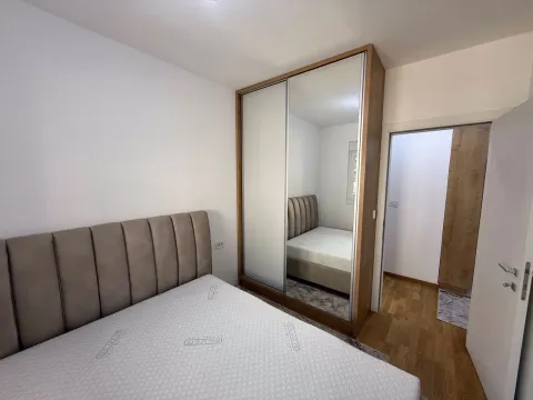 Bedroom with a double bed and a fitted wardrobe with a mirror. - image 12