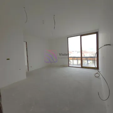 Empty room under construction with balcony doors and installed wiring. - image 13