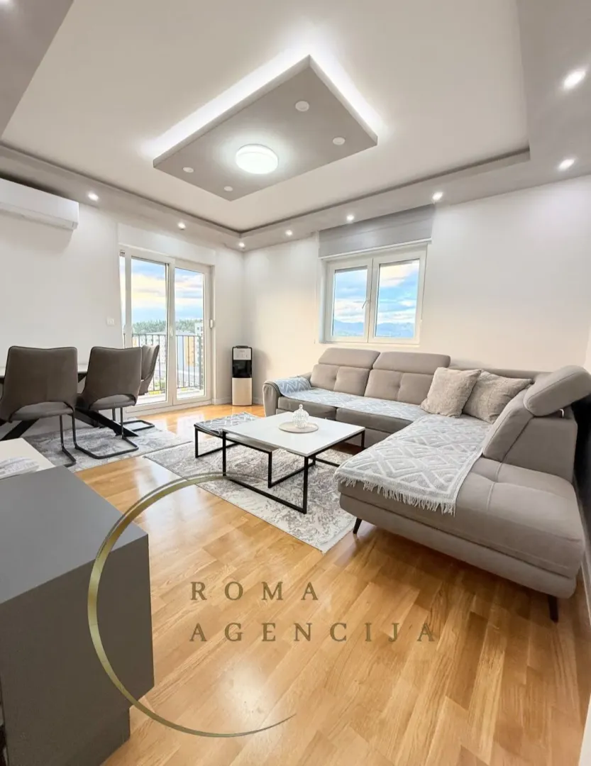 Spacious living room with a sofa set and dining area.