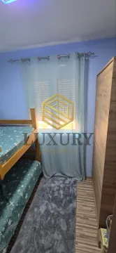 Children's bedroom with bunk bed, wardrobe, and a window with curtains. - image 12