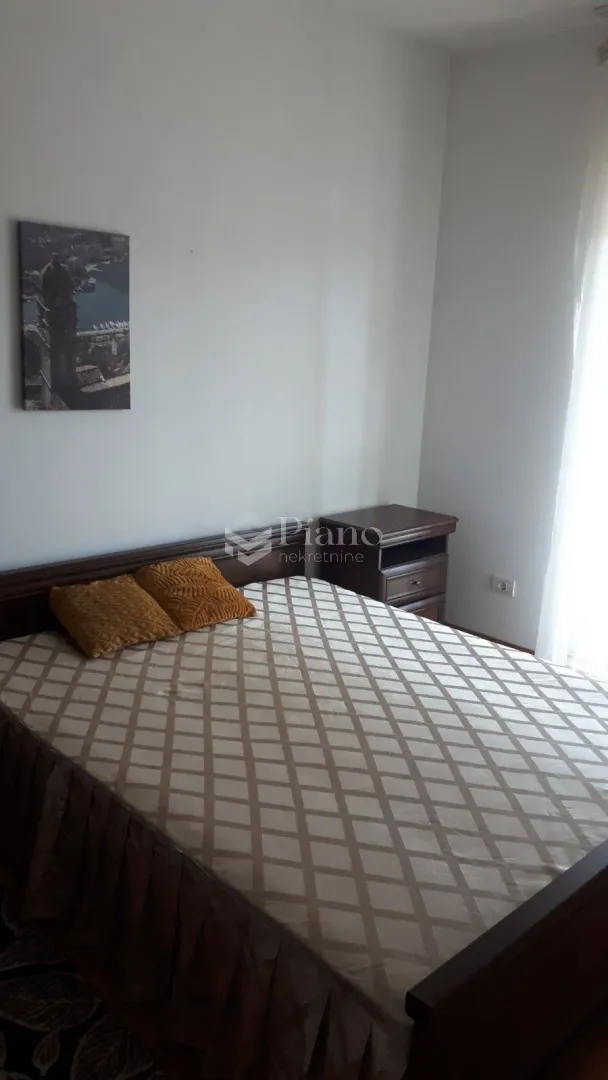 Bedroom with a double bed and a nightstand.