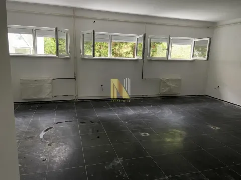 Empty room with dark floor tiles and open windows. - image 4