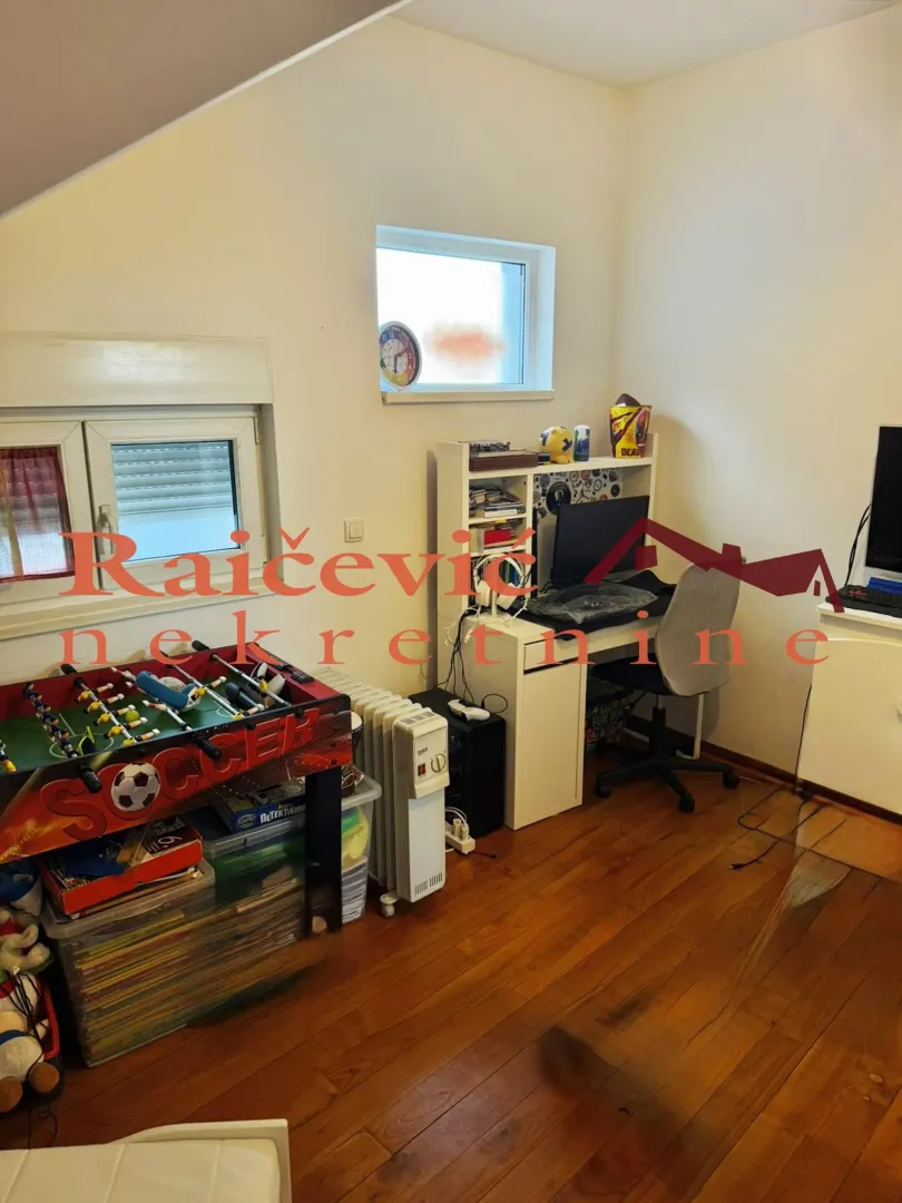 Children's room with a computer desk and a foosball table.