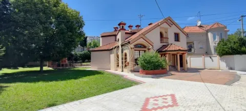 Exterior view of the house with a landscaped yard and lawn. - image 2