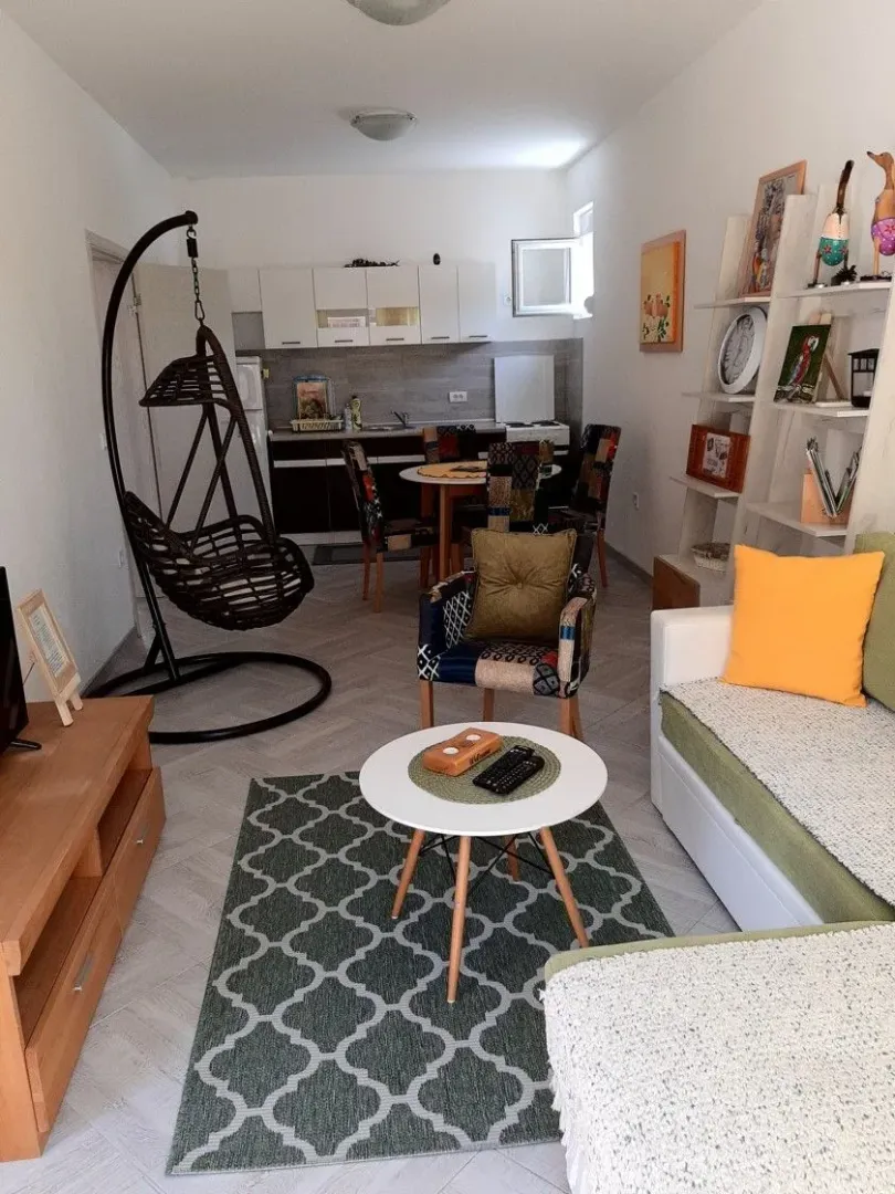 Living room connected to the dining area and kitchen.
