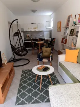 Living room connected to the dining area and kitchen. - image 2