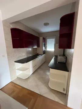 Small kitchen with double-row cabinetry and countertops. - image 7